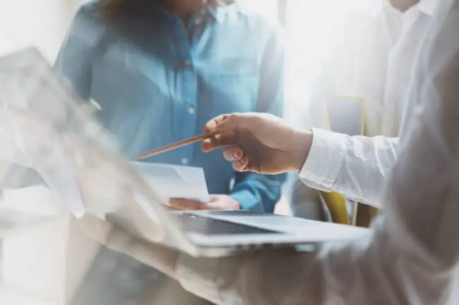 Team work process. Photo young professionals crew working with new startup project. Project managers meeting. Analyze plans, papers.